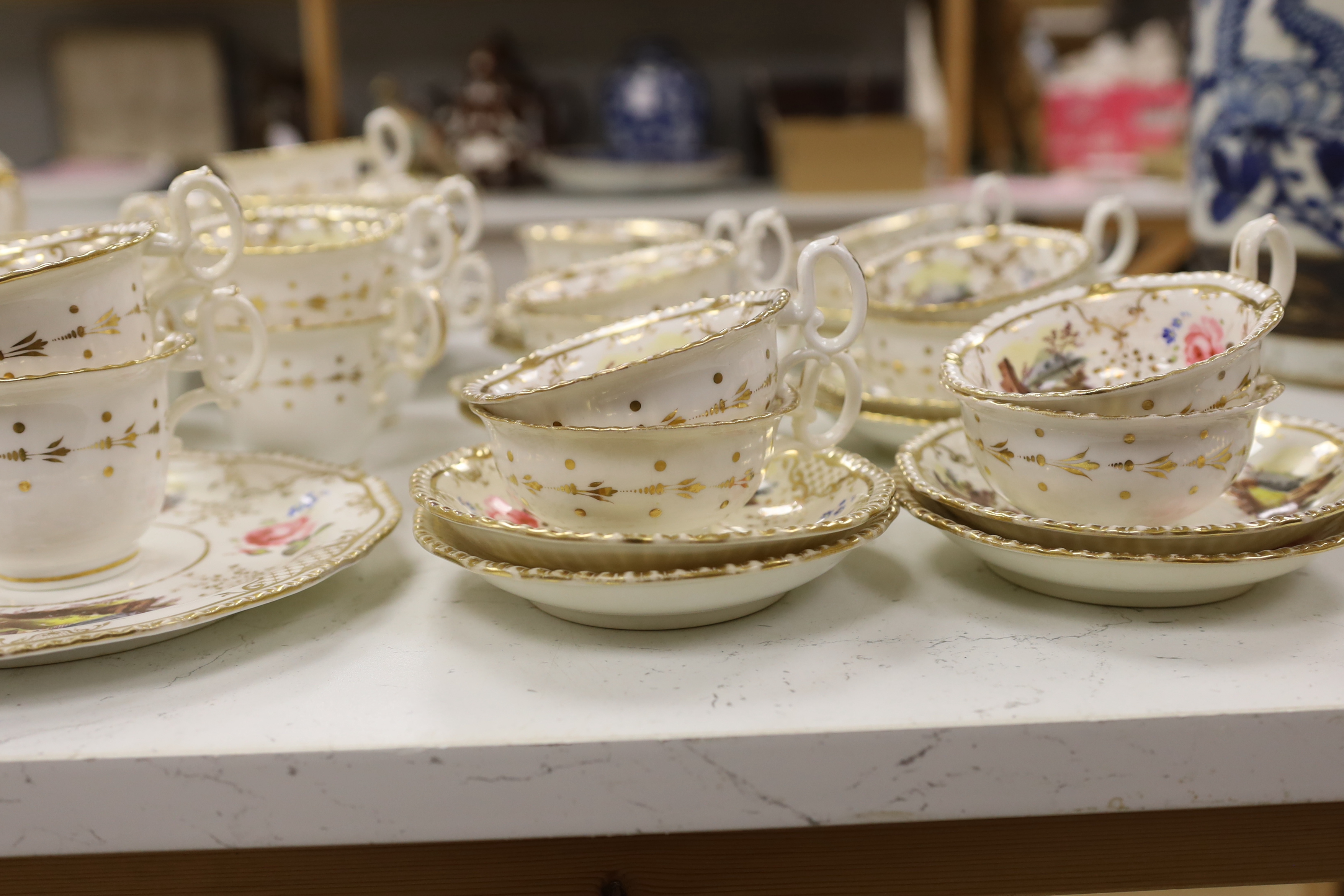 An early 19th century H & R Daniel landscape painted tea and coffee set, including twelve tea cups and saucers, twelve coffee cups, a teapot, a jug and a covered serving bowl, teapot 15cm high